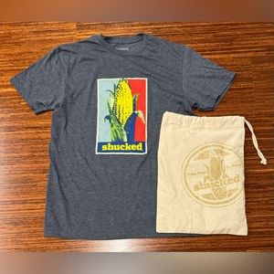 Shucked Broadway Musical Shirt size medium new unworn comes with bag